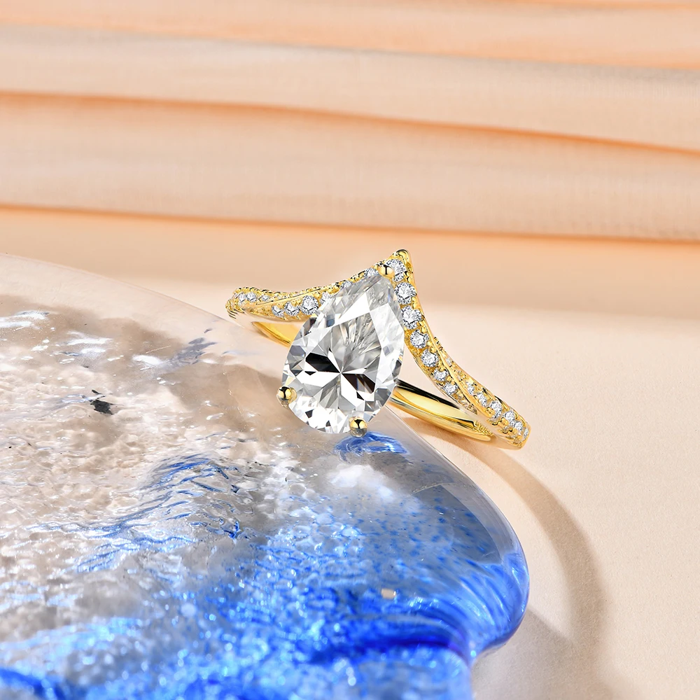 Luxurious-Pear-Shape-Moissanite-Ring-in-Pure-Gold Luxurious Pear Shape Moissanite Ring in Pure Gold