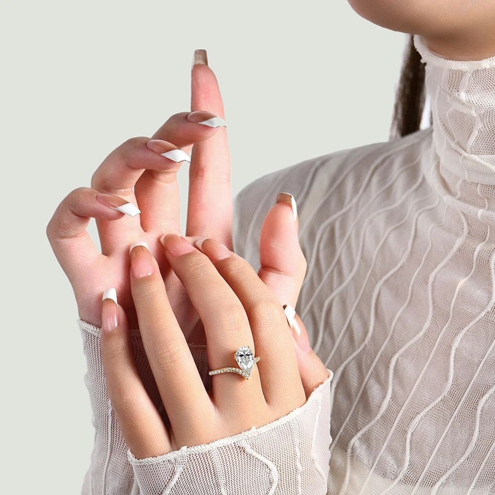 Luxurious-Pear-Shape-Moissanite-Ring-in-Pure-Gold Luxurious Pear Shape Moissanite Ring in Pure Gold